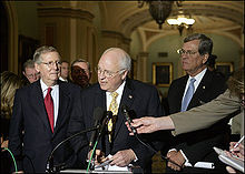 Cheney speaks to the press flanked by fellow Republicans Mitch McConnell (left) and Trent Lott, April 2007