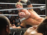 Ziggler applying a headlock to Alex Riley.