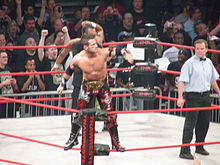 Shelley with an IWGP Junior Heavyweight Tag Team Championship belt at Slammiversary 2009.