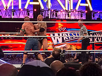 The Rock performing the Rock Bottom on John Cena.