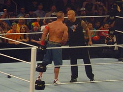 The Rock and John Cena agree to a match at WrestleMania XXVIII, one year in advance.
