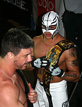 Guerrero and Mysterio with the WWE Tag Team Championship belts.