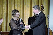 Fitzgerald shakes hands with President Ronald Reagan after performing in the White House, 1981