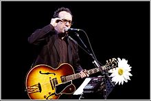 Elvis Costello performing at a Promotional[disambiguation needed] concert. (Summer 2006).