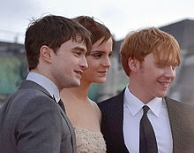 Watson with Daniel Radcliffe (left) and Rupert Grint at the London premiere of Deathly Hallows – Part 2 in July 2011