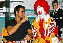 Iglesias with Ronald McDonald in 1999, his Cosas del Amor tour was sponsored by McDonald's.
