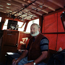 Ernest Hemingway in the cabin of his boat Pilar, off the coast of Cuba