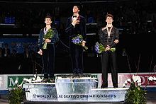 Lysacek (center) on the podium at the 2009 World Figure Skating Championships