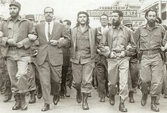 Castro (far left), Che Guevara (center), and other leading revolutionaries, marching through the streets in protest at the La Coubre explosion, 5 March 1960.