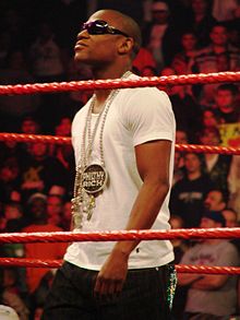 Mayweather standing in a professional wrestling during his brief tenure in the WWE