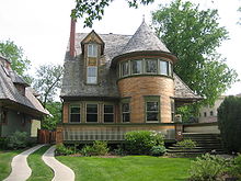 The Walter Gale House (1893) is Queen Anne in style yet features window bands and a cantilevered porch roof which hint at Wright's developing aesthetics