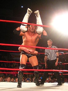Kazarian performing the Fade to Black on Brian Kendrick.