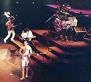 Freddie Mercury playing guitar during a live concert with Queen in Frankfurt, Germany, 1984.