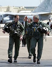 Bush, with Naval Flight Officer Lieutenant Ryan Philips, in the flight suit he wore for his televised arrival and speech in 2003