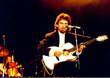 Harrison, performing for The Prince's Trust charity in 1987, playing "Here Comes the Sun" at Wembley Arena