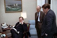 Bush speaks on the telephone regarding Operation Just Cause with General Brent Scowcroft and Chief of Staff John H. Sununu, 1989