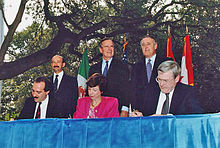 From left to right: (standing) President Carlos Salinas, President Bush, Prime Minister Brian Mulroney; (seated) Jaime Serra Puche, Carla Hills, and Michael Wilson at the NAFTA Initialing Ceremony, October 1992