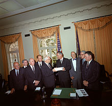 The Warren Commission presents its report to President Johnson