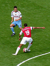 Gilberto (right) faces up to ex-Aston Villa captain Gareth Barry