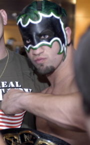 Helms as "The Hurricane" with the World Tag Team Championship