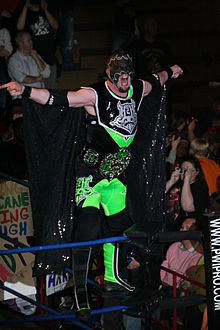 Helms posing on the turnbuckle as The Hurricane in January 2012