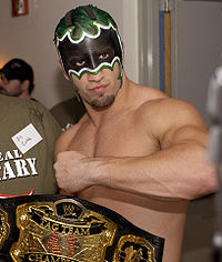 Helms (as The Hurricane) with the World Tag Team Championship.