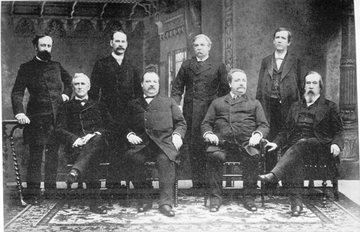 Cleveland's first cabinet. Front row, left to right: Thomas F. Bayard, Cleveland, Daniel Manning, Lucius Q. C. Lamar Back row, left to right: William F. Vilas, William C. Whitney, William C. Endicott, Augustus H. Garland