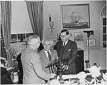 President Truman in the Oval Office, receiving a Hanukkah Menorah from the Prime Minister of Israel, David Ben-Gurion (center). To the right is Abba Eban, Ambassador of Israel to the U.S.
