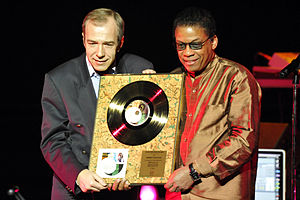 Hancock presented with Gold Record Award by Kazimierz Pułaski of Sony Music Poland. November 29, 2011