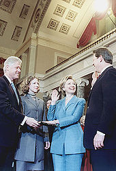 Reenactment of Hillary Rodham Clinton being sworn in as a United States Senator by Vice President Al Gore in the Old Senate Chamber, as President Clinton and daughter Chelsea look on. January 3, 2001.