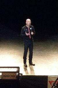 Howie Mandel performing his stand-up comedy outdoors for an audience in Monroe, Washington.