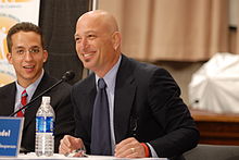 Mandel speaking at a government function on mental health.