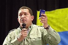 Chávez holds a miniature copy of the 1999 Venezuelan Constitution at the 2005 World Social Forum held in Brazil.
