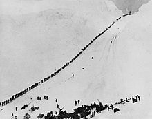 Miners and prospectors ascend the Chilkoot Trail during the Klondike Gold Rush