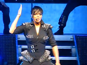 Jackson performing during her Number Ones, Up Close and Personal tour.