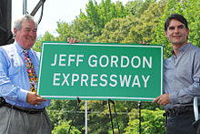 Gordon (right) unveiling the Jeff Gordon Expressway sign