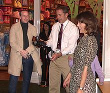 Grey with her husband, actor Clark Gregg (left) at the November 30, 2010 Epic Mickey launch party