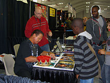 Lawler signing autographs for fans at the New York Comic Convention in Manhattan, October 16, 2011.