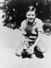 Jimmy Carter (around age 13) with his dog, Bozo, in 1937.