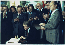 U.S. President Jimmy Carter signs the Airline Deregulation Act.