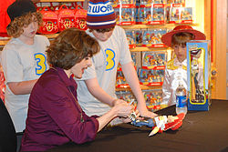 Cusack pictured, autographing Toy Story 3 merchandise at an event