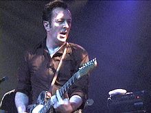 Strummer performing in Brooklyn, April 2002.