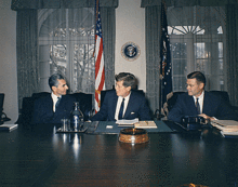 Persian Shah Mohammad Reza Pahlavi, Kennedy, and U.S. Defense Secretary Robert McNamara in the White House Cabinet Room on April 13, 1962