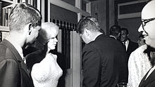 Marilyn Monroe, President Kennedy (back to camera), and Attornery General Robert F. Kennedy in 1962.