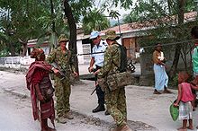 Australian peacekeepers and East Timorese civilians in Dili during 2000