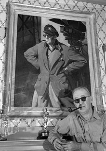 John Ford with portrait and Oscar, circa 1946