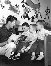 Carson reading a story to his three sons in 1955. From left: Chris, Cory, and Richard (Ricky).