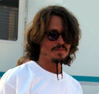 Depp wearing a mustache and goatee similar to the style used in Pirates of the Caribbean: The Curse of the Black Pearl