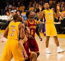 Bynum and teammate Ron Artest (now known as Metta World Peace) watch a shot along with Manny Harris.