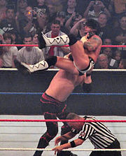 Kane performing a chokeslam on CM Punk.